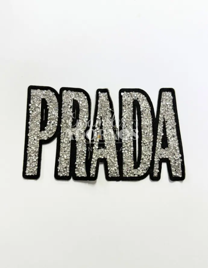 APLICACION CONICA ADHESIVA PRADA 13.4X8CM (PQT X 6 UND)
