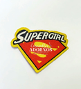 APLICACION PLANCHA. ESCUDO SUPERGIRL 6.5X5CM (PQT X 50 UND)